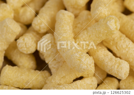 corn sticks closeup, a large number of ready-made corn sticks for eating or making breakfast with milk 126625302