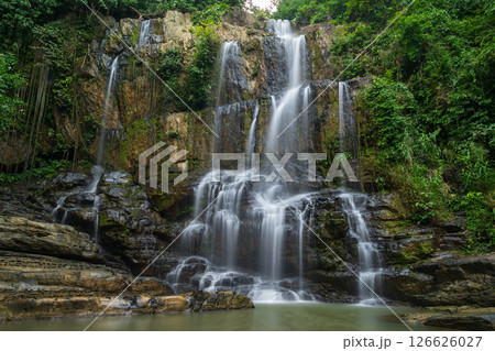 waterfalls in deep forest National Park ,Kanchanaburi ,A beautiful stream water famous rainforest waterfall in Thailand	 126626027