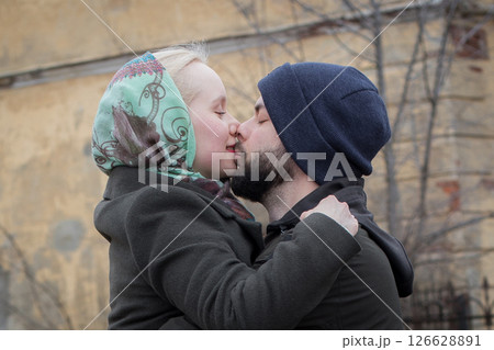 Cheerful young couple expressing their feelings on the street Cheerful young couple expressing their feelings on the street 126628891