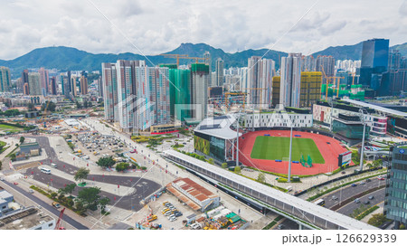 View of a Modern Stadium with Green Field and Tracks 126629339