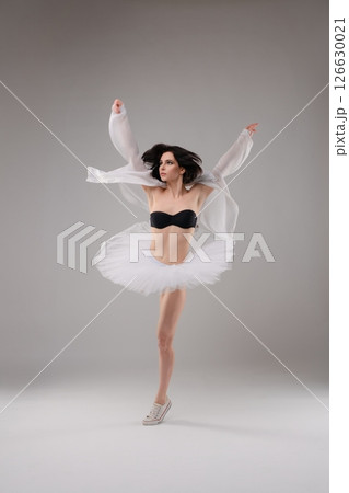 Woman in lingerie performs dance poses in ballet studio environment Woman in lingerie performs dance poses in ballet studio environment 126630021