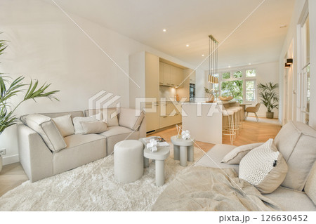 Bright and spacious living room featuring modern furniture, light tones, and an inviting atmosphere, perfect for relaxation and socializing. Bright and spacious living room featuring modern furniture, light tones, and an inviting atmosphere, perfect for relaxation and socializing. 126630452