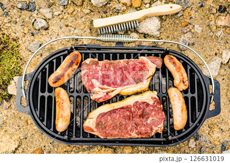 Grilled meat on barbecue grill 126631019