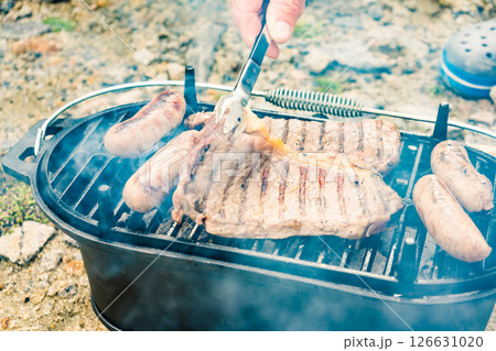 Grilled meat on barbecue grill 126631020