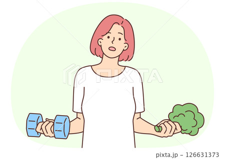 Woman holding dumbbells and broccoli wanting to choose way to lose weight 126631373
