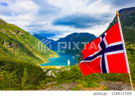 Norwegian flag and Geiranger fjord landscape Norwegian flag and Geiranger fjord landscape 126631509