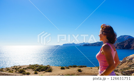 Woman enjoy sea breeze. Woman enjoy sea breeze. 126631751