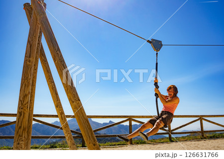 Adult woman having fun on zipline 126631766