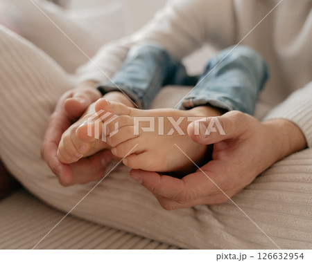 baby feet, boy feet, foot massage, dad tickles son's feet, foot tickling . High quality photo baby feet, boy feet, foot massage, dad tickles son's feet, foot tickling . High quality photo 126632954