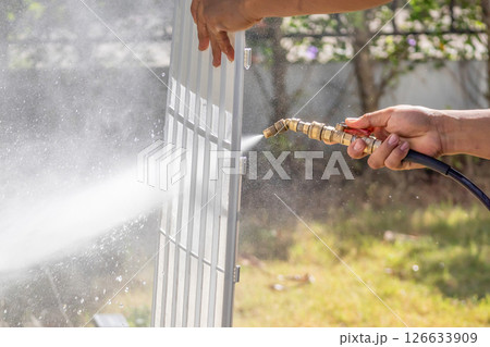 air conditioning filter cleaning with water spray 126633909