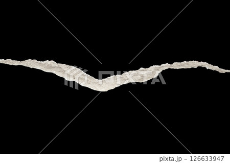 Ripped torn paper edges isolated on black background Ripped torn paper edges isolated on black background 126633947