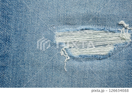 Denim blue jeans torn fashion design texture close up background 126634088