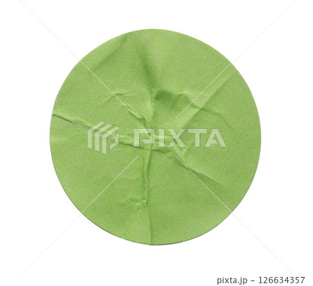 Blank green round adhesive paper sticker label isolated on white background 126634357