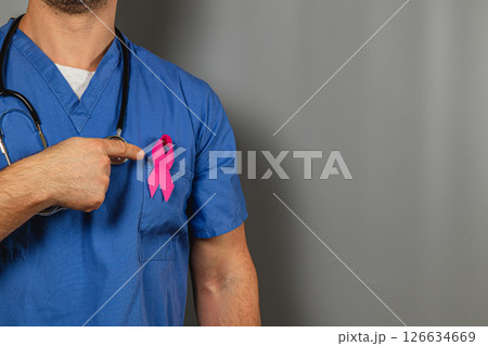 Healthcare professional promotes breast cancer awareness with pink ribbon 126634669