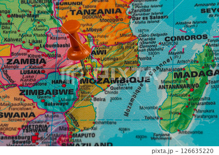 Pin marking location in Mozambique on a colorful map 126635220
