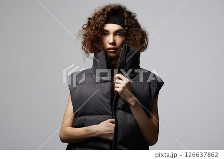 fashion portrait of beautiful young woman in stylish vest 126637862