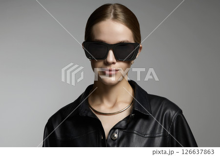 Beautiful young woman in sunglasses 126637863
