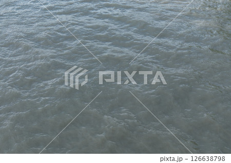 Rippling water surface reflects natural light. High quality photo Rippling water surface reflects natural light. High quality photo 126638798