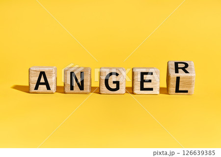 Wooden blocks forming words ANGEL to ANGER over yellow background. Wooden blocks forming words ANGEL to ANGER over yellow background. 126639385