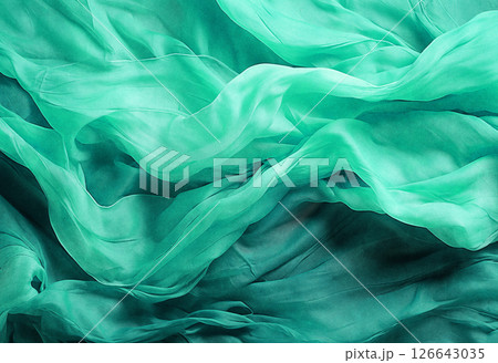 Green luxurious background, the fabric lies in soft waves. 126643035