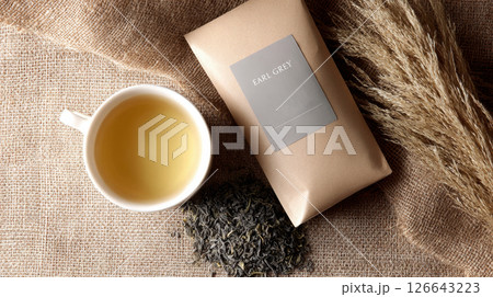 Enjoy a steaming cup of earl grey tea with bergamot in a cozy, rustic atmosphere Enjoy a steaming cup of earl grey tea with bergamot in a cozy, rustic atmosphere 126643223