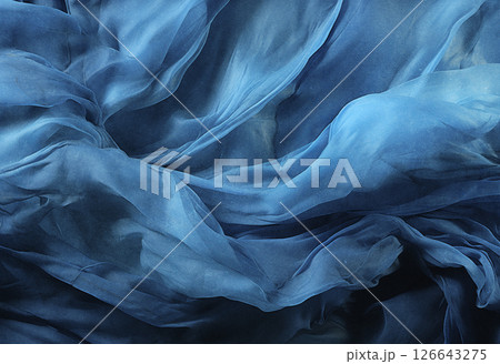 Blue luxurious background, the fabric lies in soft waves. 126643275