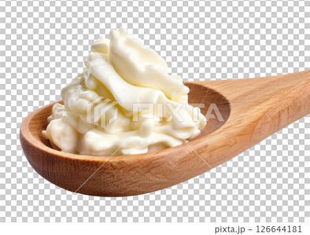 Wood spoon with sour cream 126644181