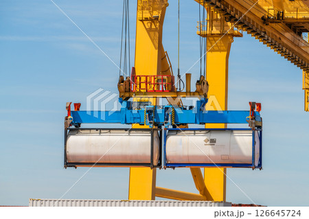 Container Crane Lifting Tank Container at Port Terminal Container Crane Lifting Tank Container at Port Terminal 126645724