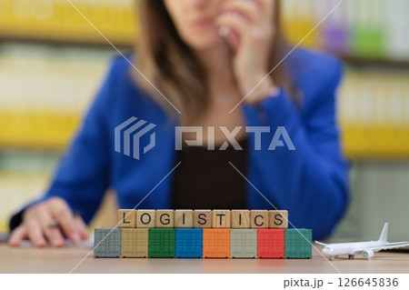 A dedicated Professional Woman specializing in Logistics Management and Cargo Blocks 126645836