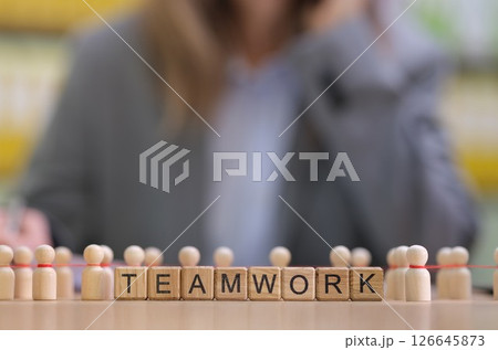 Concept of Teamwork Illustrated Through Various Figurines and Letter Blocks Together Concept of Teamwork Illustrated Through Various Figurines and Letter Blocks Together 126645873