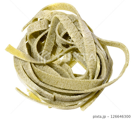 Nest of dry green egg pasta tagliatelle with spinach, isolated background 126646300