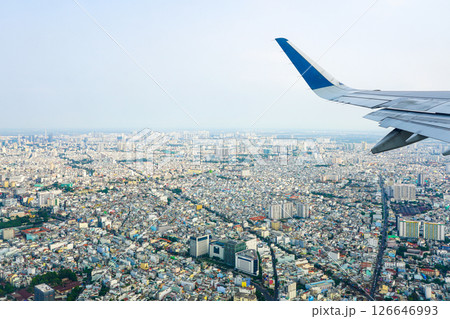 Aerial view of Ho Chi Minh City from airplane window above sprawling urban landscape 126646993