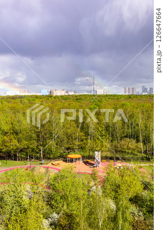 sunlit playground and green city park after rain 126647664