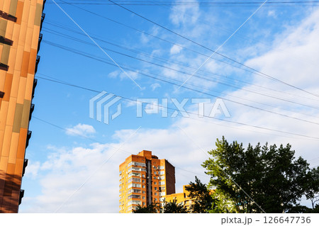 electric wires and cables in blue sky and houses electric wires and cables in blue sky and houses 126647736