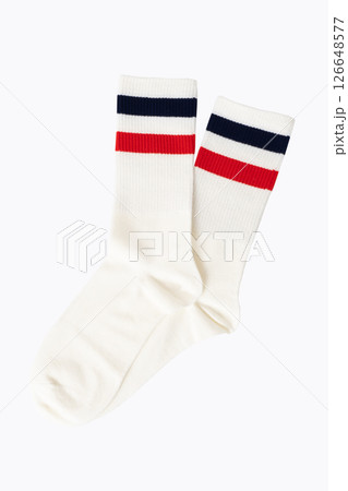 White athletic socks with red and navy stripes on plain background 126648577