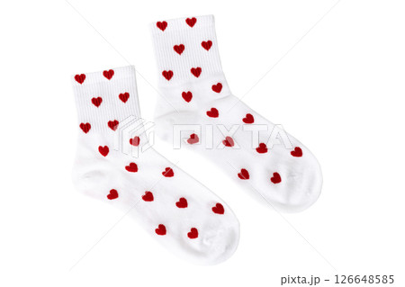 White socks with red heart patterns on white background 126648585