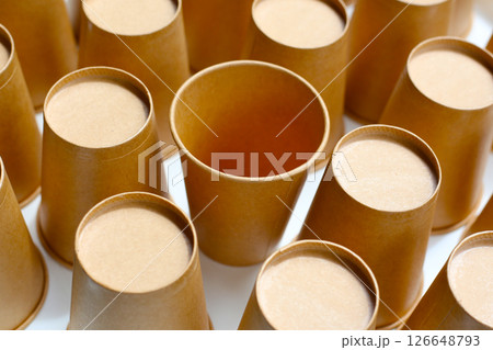 Brown paper cups on white background. 126648793