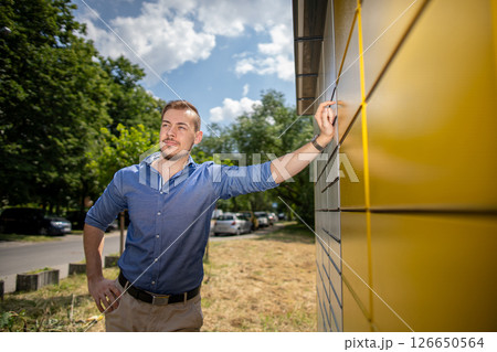 A Confident Young Man Posing Outdoors in a Stylish Shirt, Radiating Charm and Style A Confident Young Man Posing Outdoors in a Stylish Shirt, Radiating Charm and Style 126650564