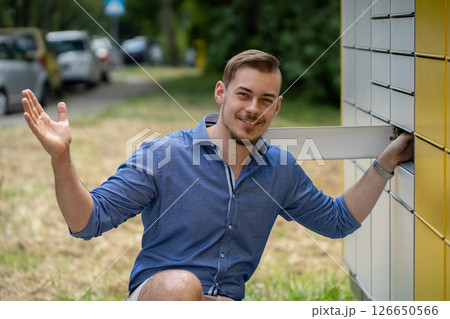 A Charming Young Man Joyfully Posing Outdoors in a Fun and Vibrant Natural Setting A Charming Young Man Joyfully Posing Outdoors in a Fun and Vibrant Natural Setting 126650566