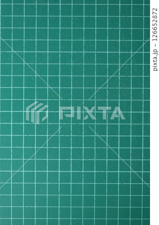 green cutting mat board background with line and scale measure guide pattern for object art design 126652872