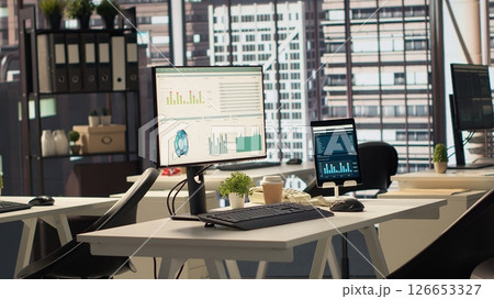 Empty business office with cubicles used in organizational activity efficiency, having advanced tech gadgets to serve a corporation with luxurious city center headquarters. Corporate culture. 126653327