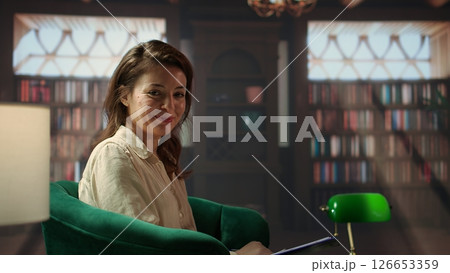 Portrait of woman counselor preparing for a session with client in the cabinet, discussing about PTSD and mental disorder for rehabilitation. Psychotherapist does an analysis on patient. Camera B. 126653359