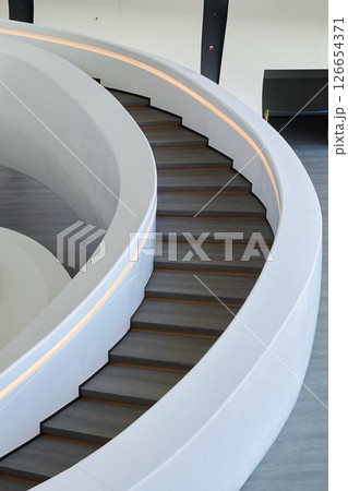 A Modern Spiral Staircase with an Elegant Design that enhances both style and functionality 126654371