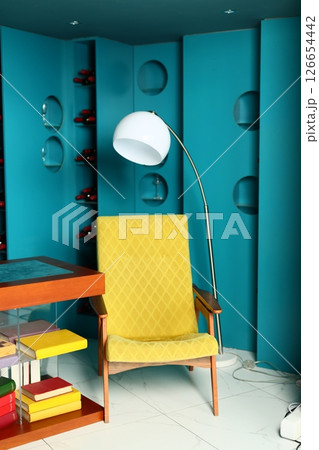 Stylish Living Room with a Bright Yellow Chair and Modern Decor for an inviting ambiance 126654442