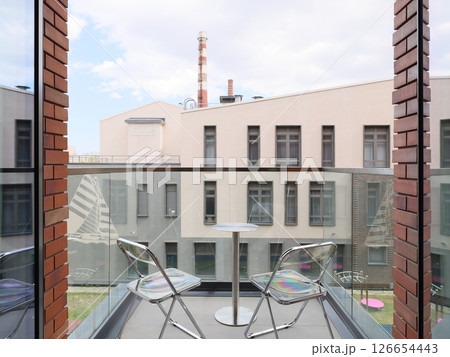 A Beautiful Modern Balcony View Overviewing a Lively Urban Landscape Full of Life and Color 126654443