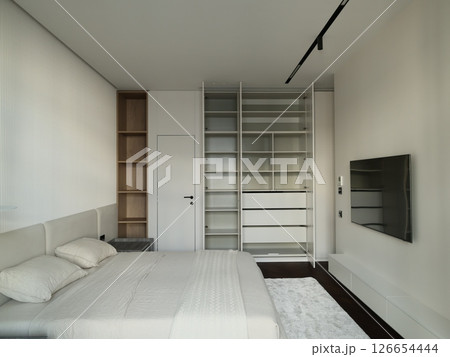 A beautifully designed Modern Minimalist Bedroom with a sleek style promoting relaxation 126654444