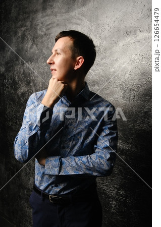 A Highly Stylish and Captivating Portrait of a Young Man Dressed in a Trendy Outfit A Highly Stylish and Captivating Portrait of a Young Man Dressed in a Trendy Outfit 126654479