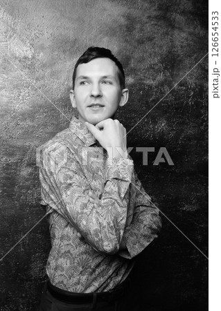 A Thoughtful Portrait of a Distinguished Man Dressed in a Classy Patterned Shirt A Thoughtful Portrait of a Distinguished Man Dressed in a Classy Patterned Shirt 126654533