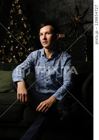 A Stylish Man Posed Elegantly in a Beautiful Holiday Setting, Exuding Charm and Confidence A Stylish Man Posed Elegantly in a Beautiful Holiday Setting, Exuding Charm and Confidence 126654727