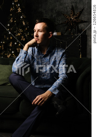 A Stylish Man Posing Elegantly Within a Cozy and Inviting Setting, Capturing Attention A Stylish Man Posing Elegantly Within a Cozy and Inviting Setting, Capturing Attention 126654816